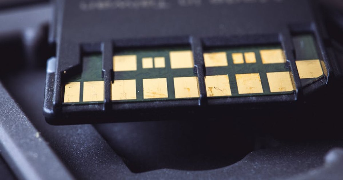 Detailed macro shot of SD card connector pins, highlighting technology and electronics.