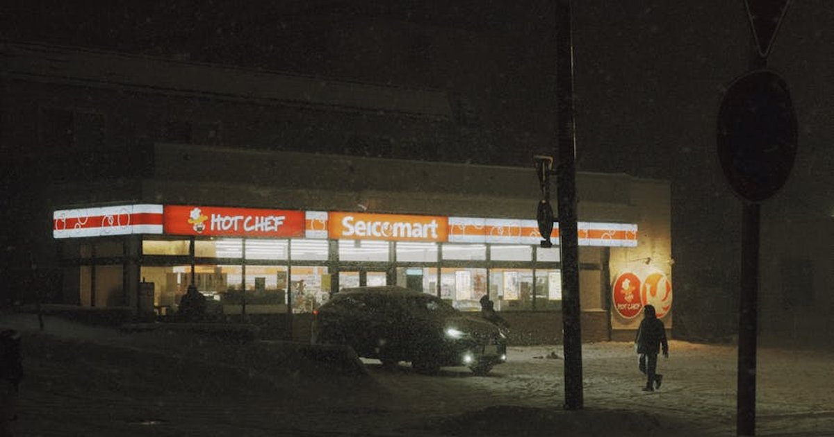 Seicomart convenience store illuminated on a snowy winter night in Hokkaido, Japan.