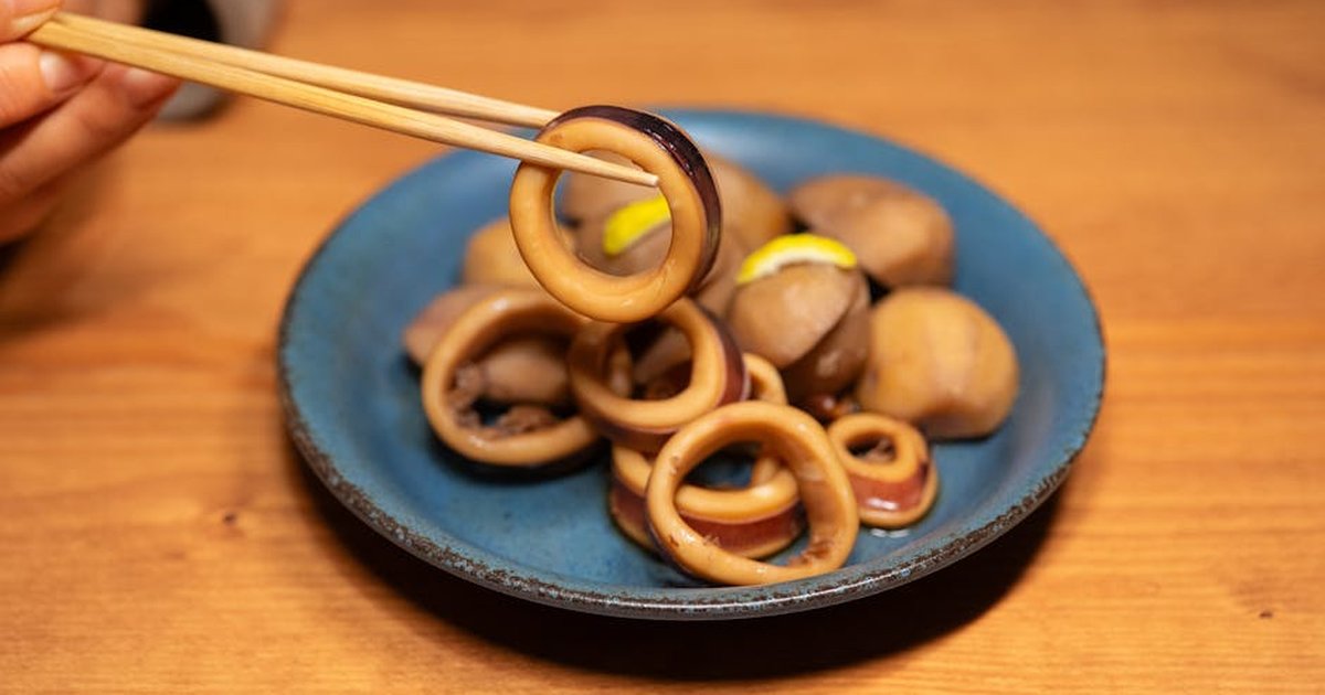 A flavorful plate of squids and potatoes, showcasing vibrant Asian cuisine.