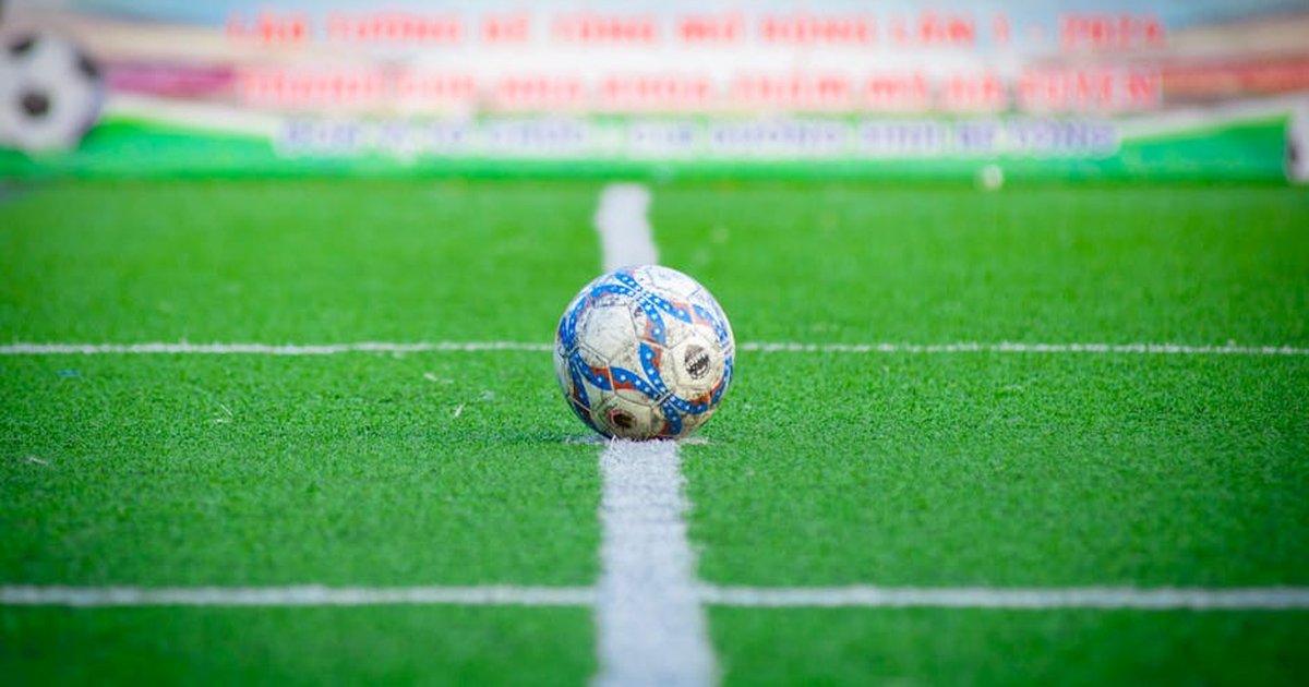 Close-up of a soccer ball on a green field in Hà Nội, Vietnam.