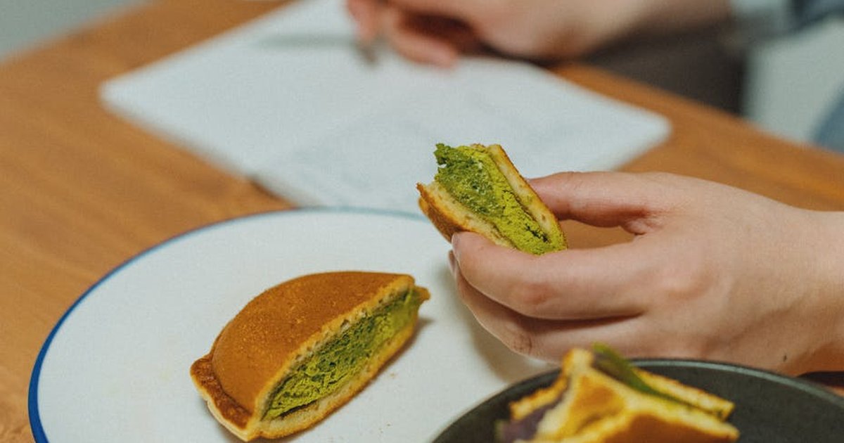 Authentic Japanese Dorayaki filled with matcha and red beans, captured indoors in Tokyo, Japan.