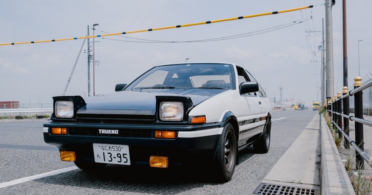Classic Toyota Trueno parked on an urban street, exuding retro charm and nostalgia.