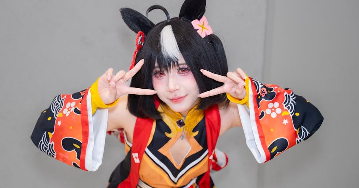 Vibrant cosplay portrait featuring a character in colorful traditional attire with playful gestures.
