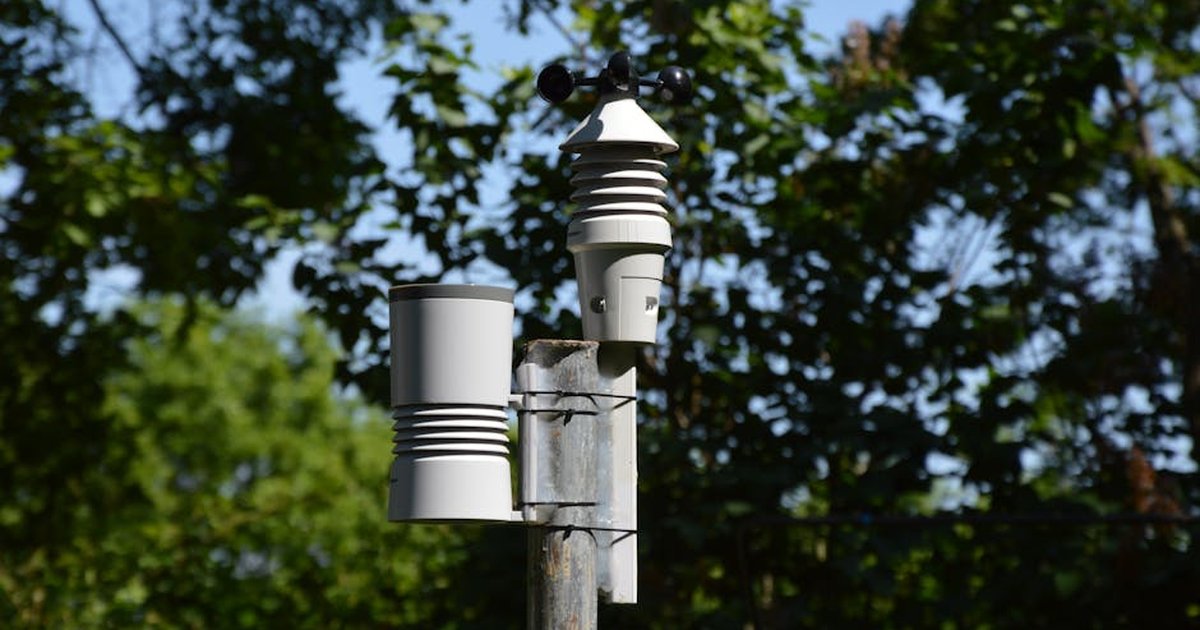 Close-up of an anemometer and weather device on a sunny day outdoors.