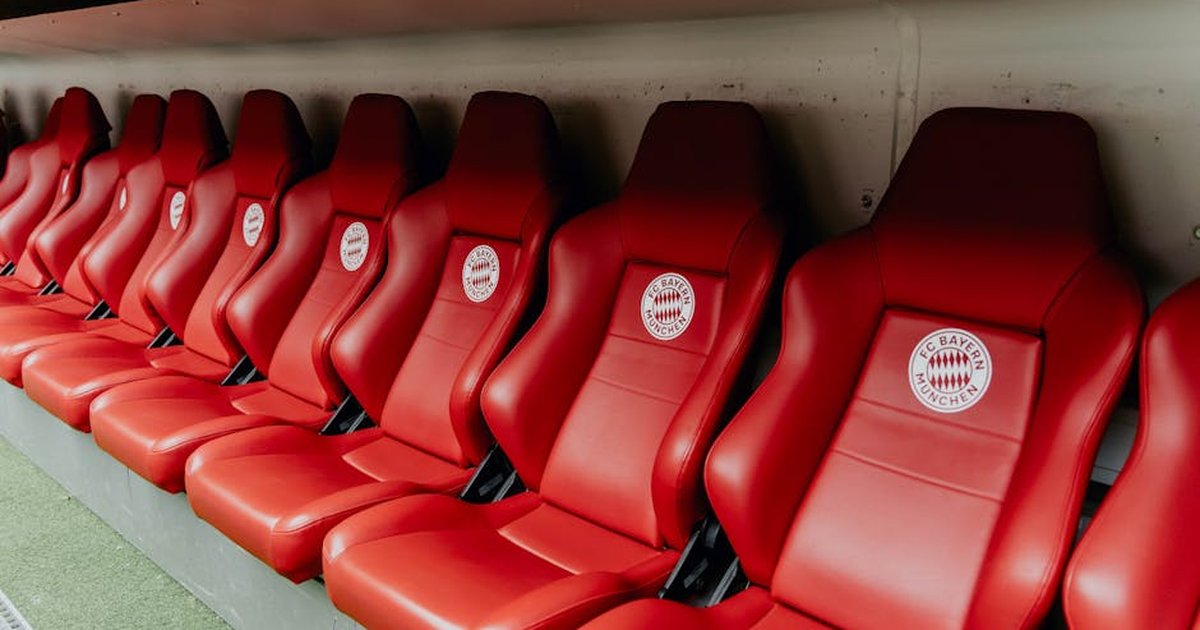 Red seats at Bayern Munich's Allianz Arena, showcasing iconic stadium design.