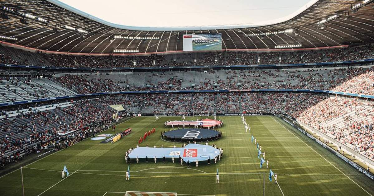 Captivating view of a soccer match at Munich's iconic Allianz Arena, filled with excited fans.