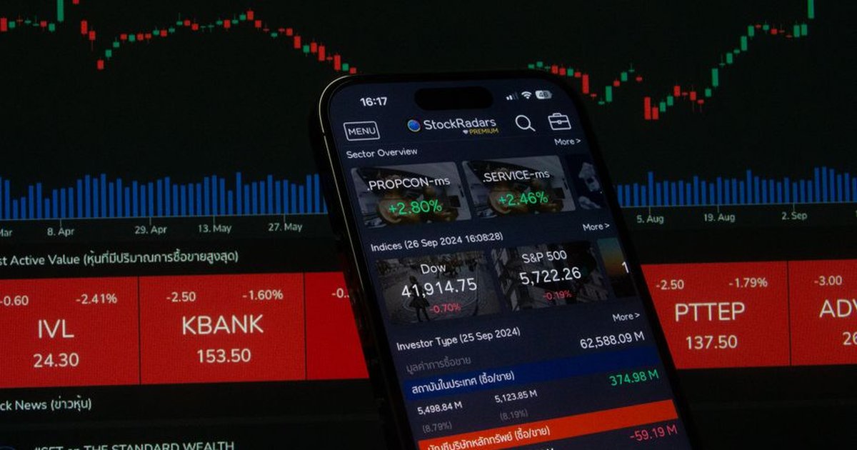 Close-up of a digital stock trading app interface with investment charts and market trends displayed.