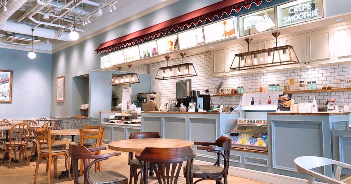A welcoming café interior with wooden tables and modern design in Chiba, Japan.