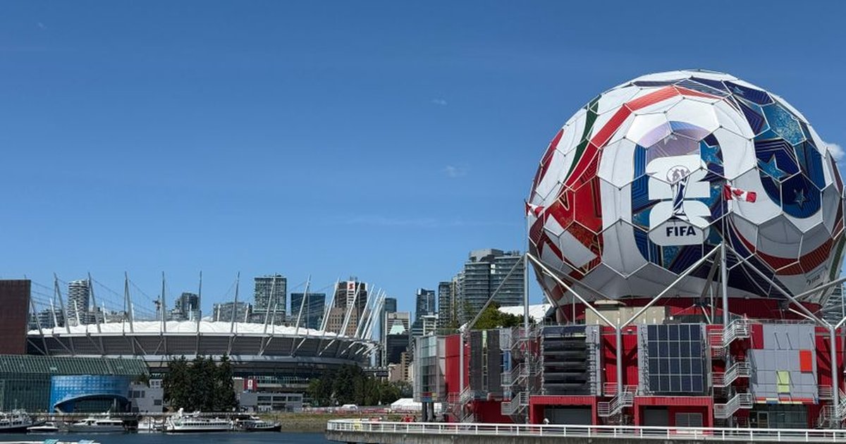Iconic FIFA soccer ball and Vancouver stadium, showcasing urban sports architecture.