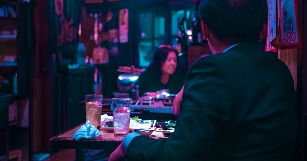 Experience the vibrant nightlife in a Tokyo izakaya, capturing the essence of Japanese dining culture.