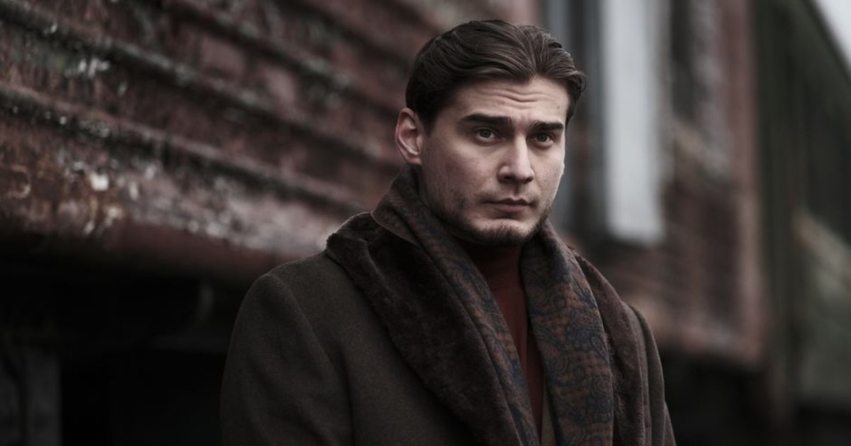 Portrait of Man Wearing Brown Coat on a Street