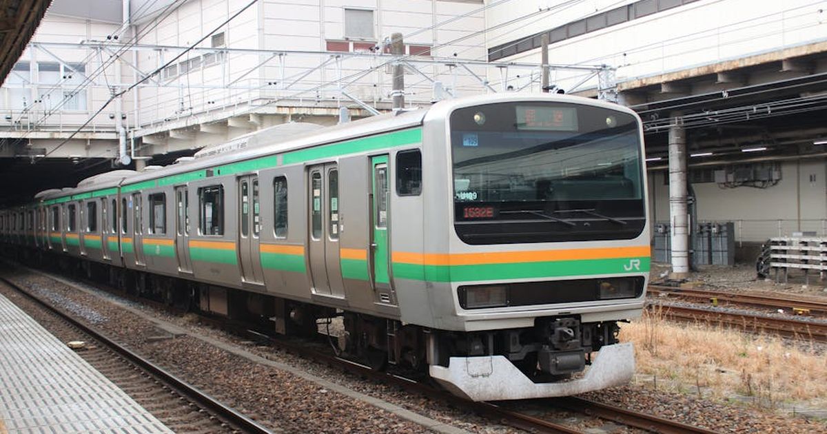 Commuter train at Utsunomiya Station, highlighting Japan's efficient rail system.