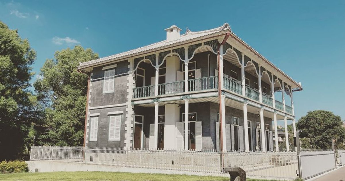 Charming historic residence in Kumamoto, Japan, showcasing unique architecture and vibrant surroundings.
