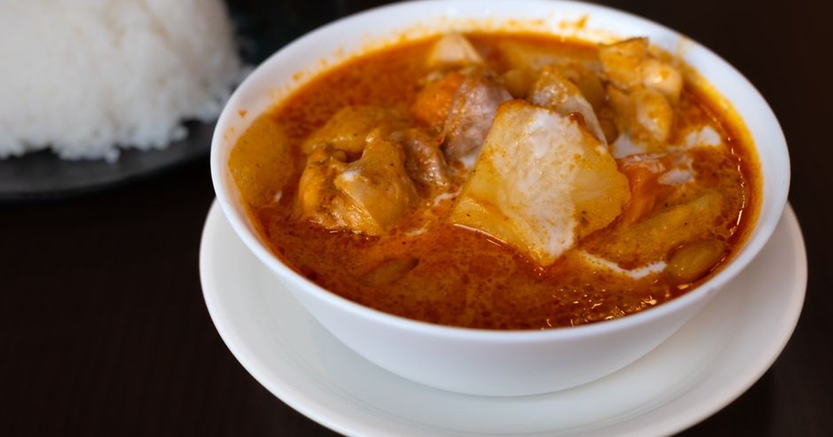 Close-up of a flavorful Japanese curry served with white rice, showcasing vibrant spices.