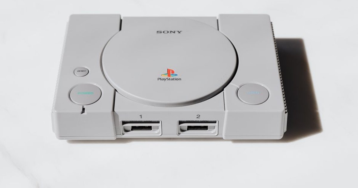 A classic Sony PlayStation console captured on a white background exuding retro gaming nostalgia.