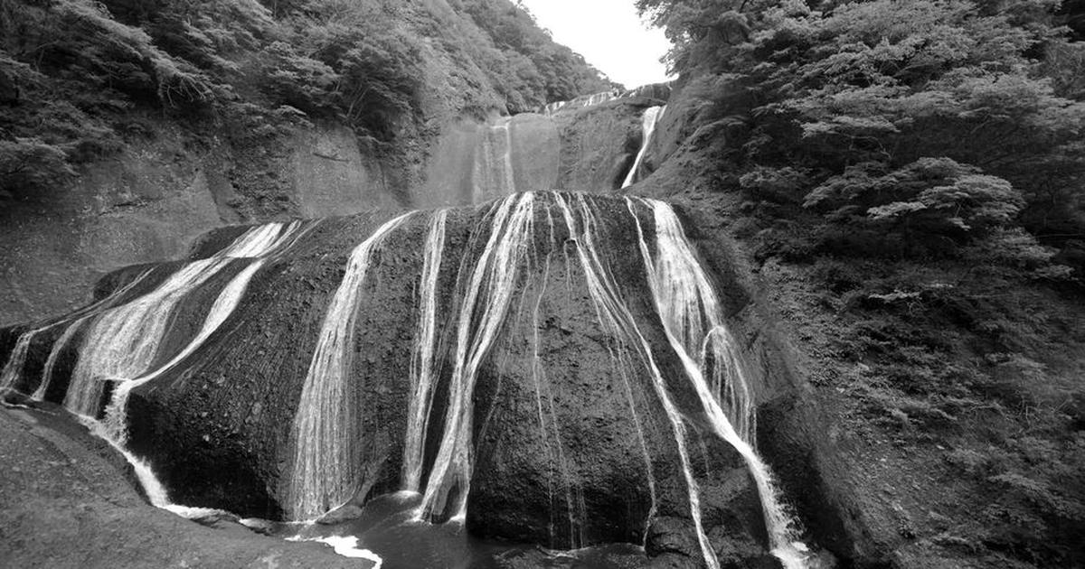 Dramatic black and white capture of the iconic Fukuroda Falls in Ibaraki, Japan.