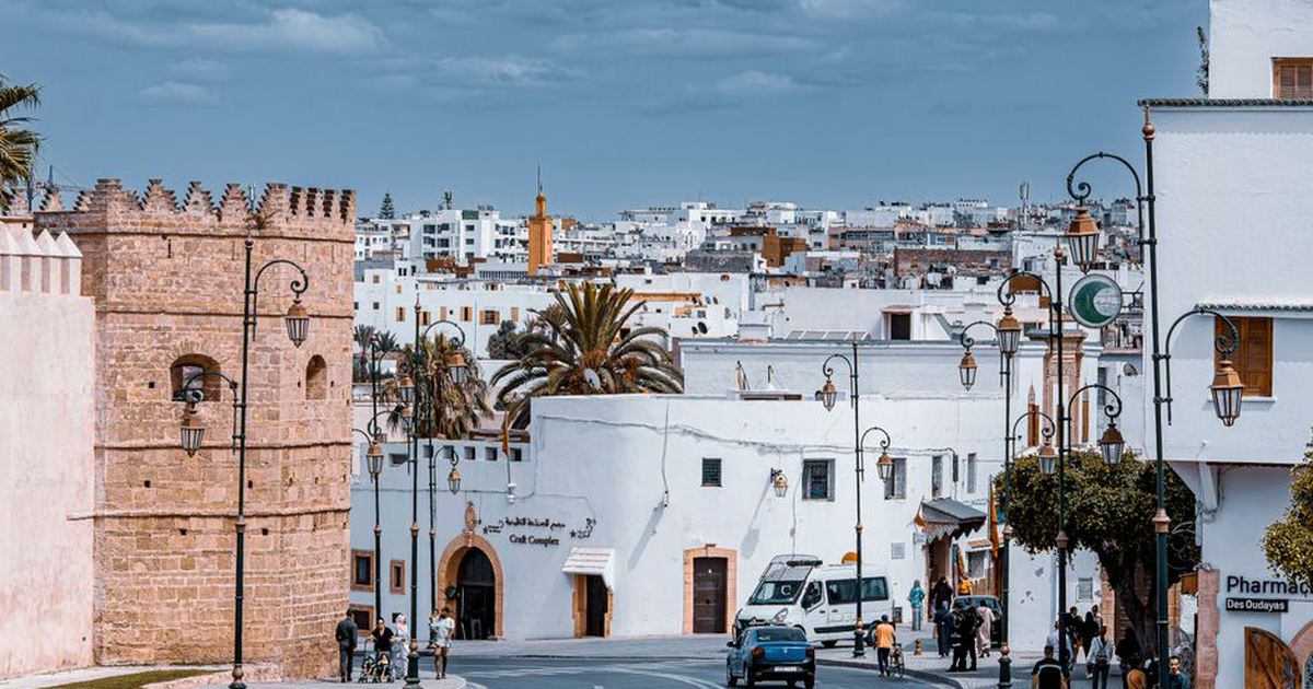 View of historic city street in Rabat, Morocco featuring traditional architecture and local life.