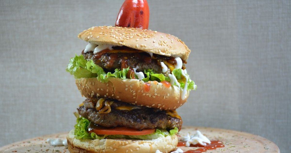 A mouthwatering double cheeseburger with fresh toppings and a sesame seed bun. Perfect for food lovers.