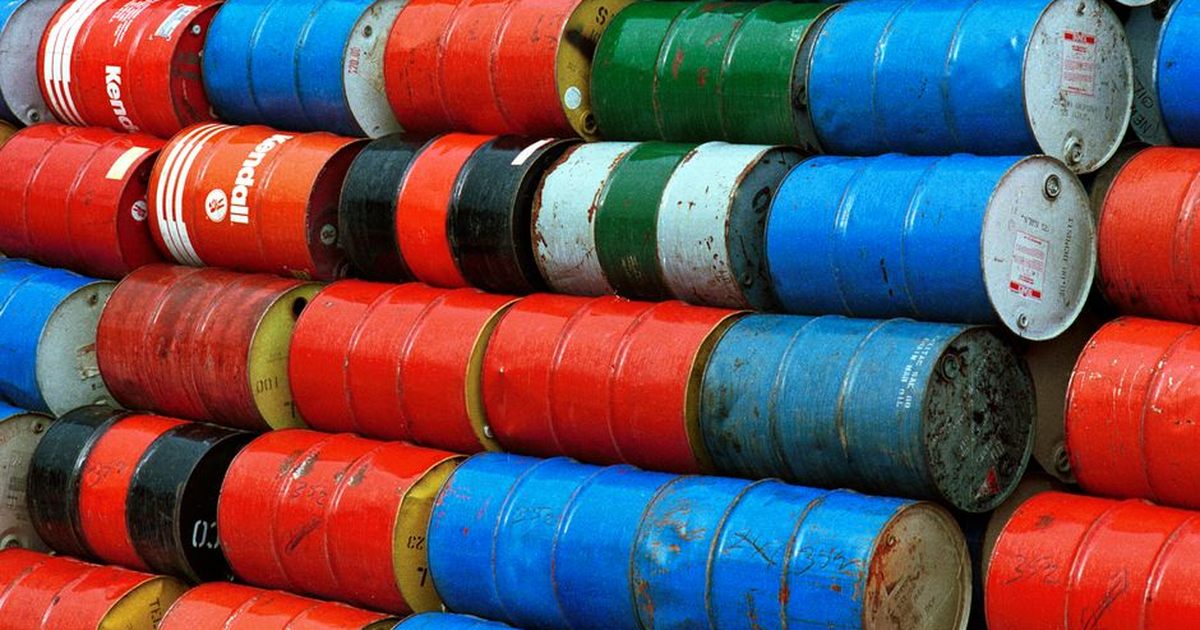 Vibrant stack of colorful industrial barrels, ideal for environmental or industrial themed projects.