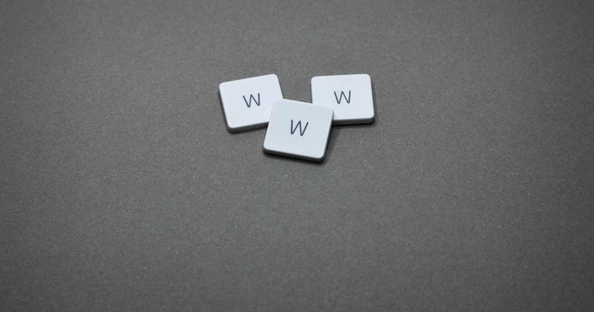 Three white letter tiles with 'W' on a gray surface, minimalist design