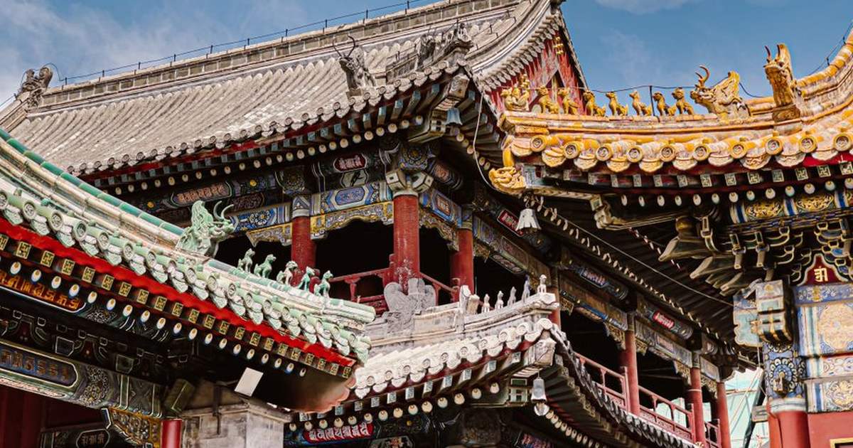 Intricate eaves and vibrant colors of a traditional temple in Beijing.