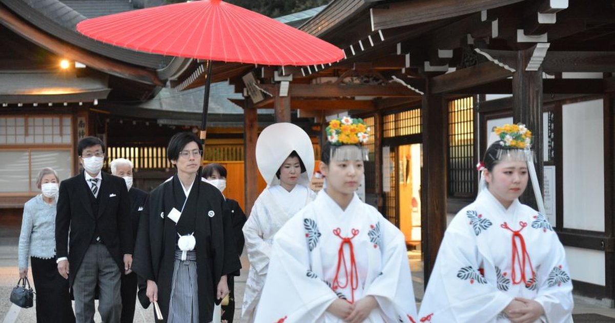 Japanese Shinto wedding procession with traditional attire at a shrine in Nara, Japan.