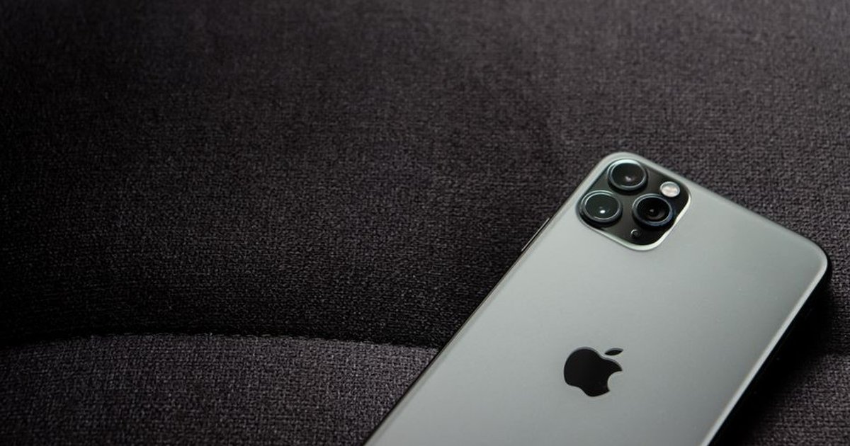 Close-up of a smartphone highlighting its modern design on a dark background.