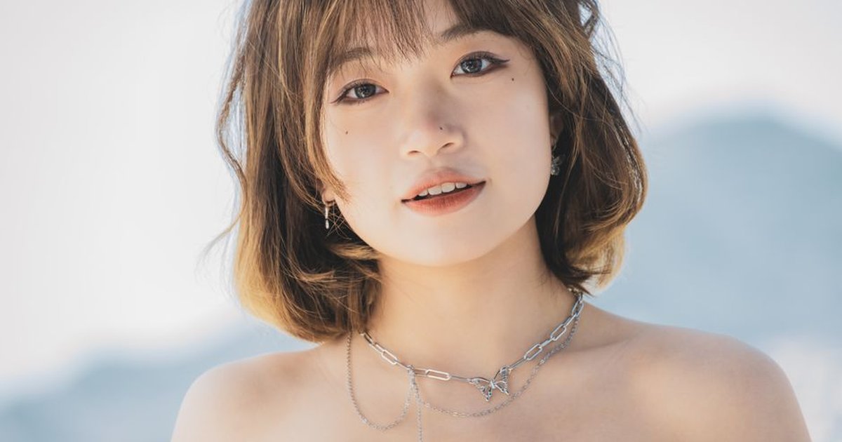 Close-up portrait of a stylish woman with necklace, outdoors in Montenegro.