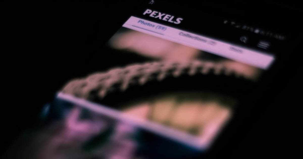 Abstract shot of a smartphone screen with blurred images and text, creating an artistic effect.