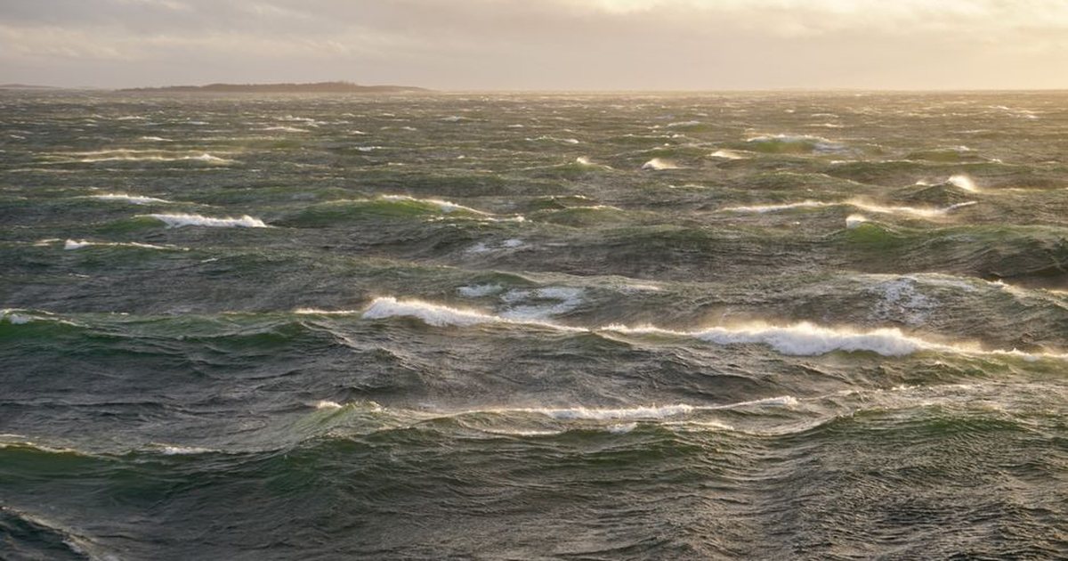 Captivating view of ocean waves under a dramatic sunset sky, showcasing nature's power and beauty.