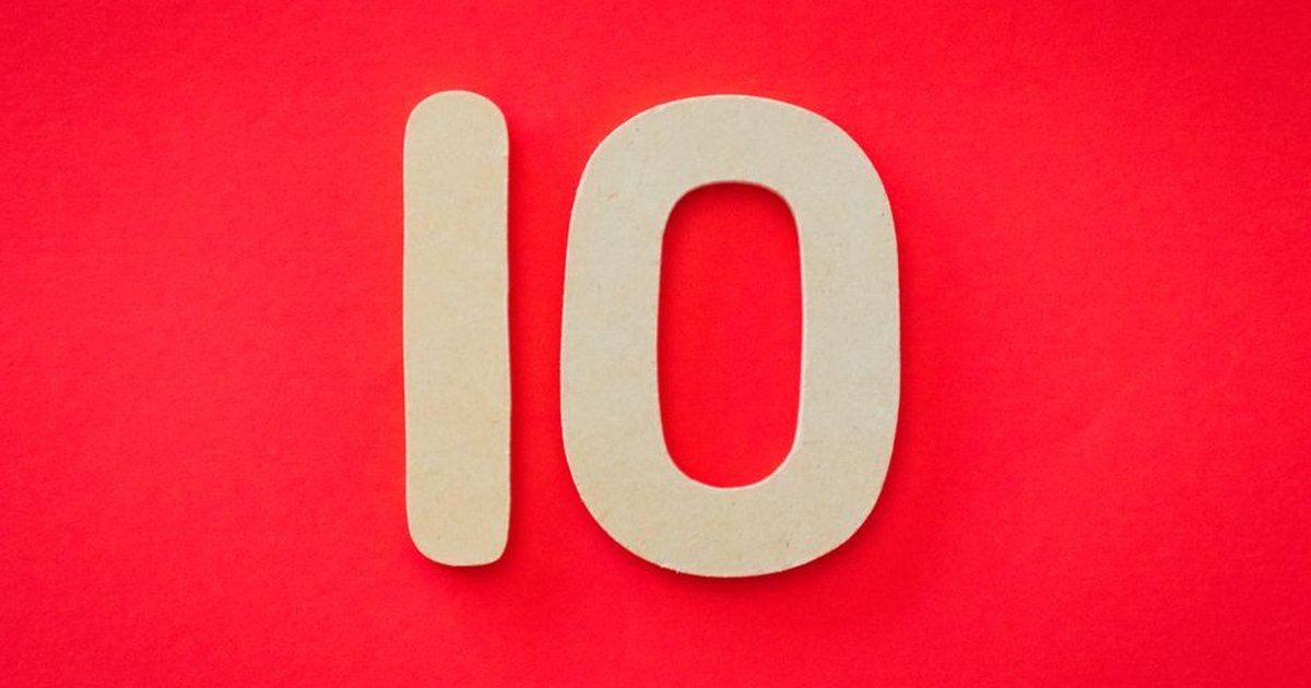 Wooden number 10 on a vibrant red background, ideal for educational and creative projects.