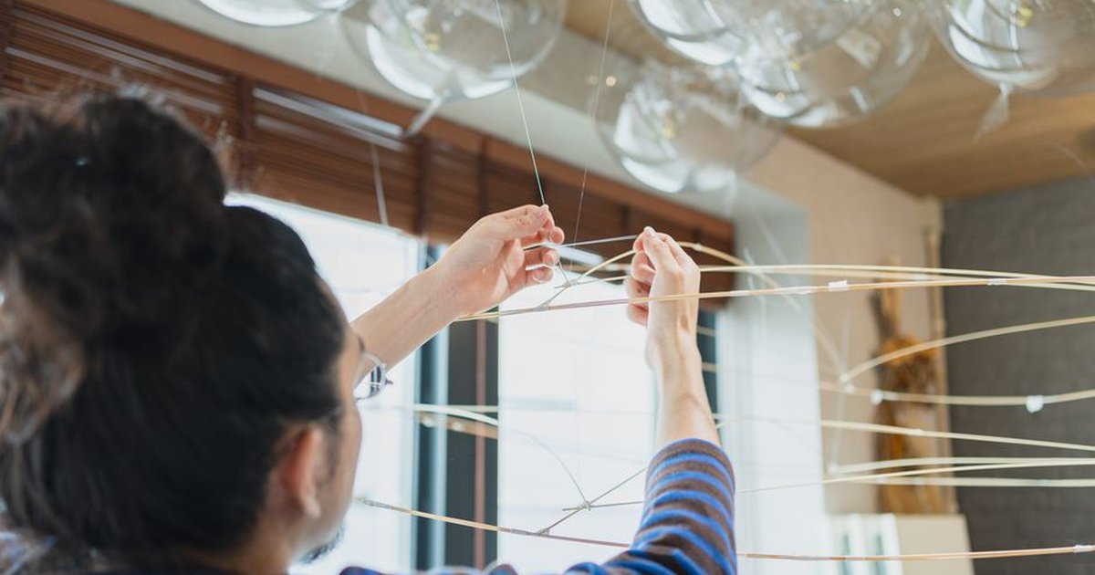Artist working on a contemporary art installation inside a Shinjuku studio, Tokyo, Japan.