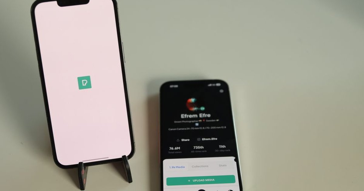 Close-up of two smartphones on a desk displaying a social media platform interface in Jönköping, Sweden.